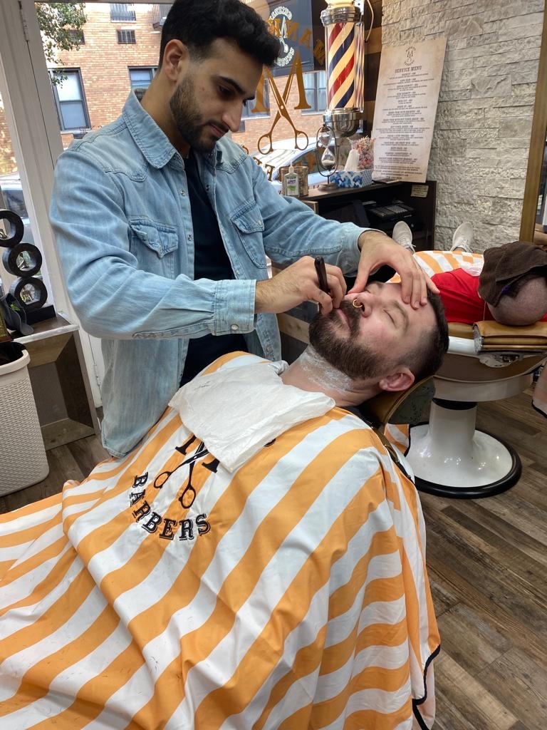 What special events or promotions does Bowery Barbering Culture offer to their loyal customers?