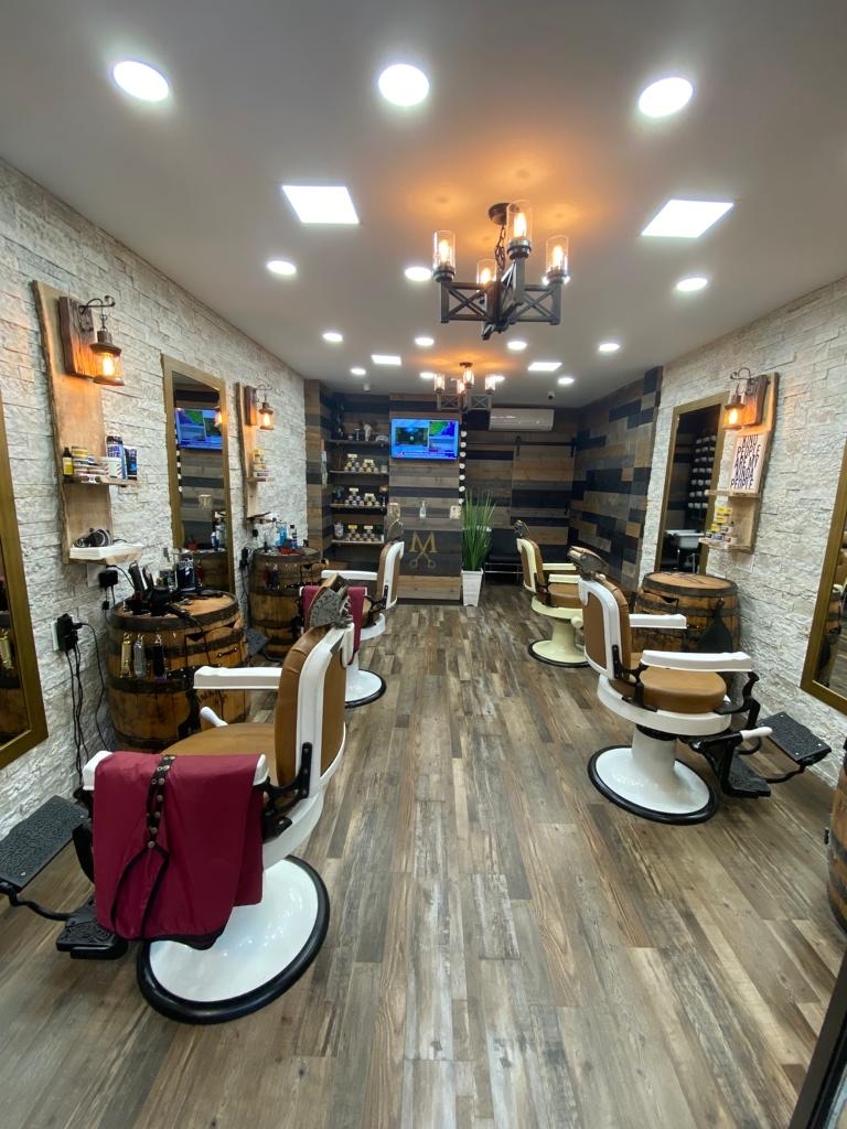 How important is it for barbers in the Financial District to stay updated on industry trends?